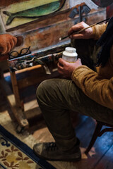 Two Georgian male artists working in their Tbilisi studio. Painting, sketching, interacting with...
