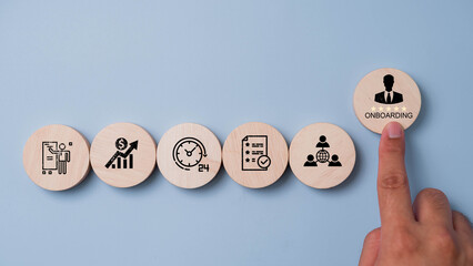 Onboarding concept. Businessman touching wooden block with welcome new employee icon for HR business industry, training new employee to know how to work in organization. welcome, knowledge, and skills