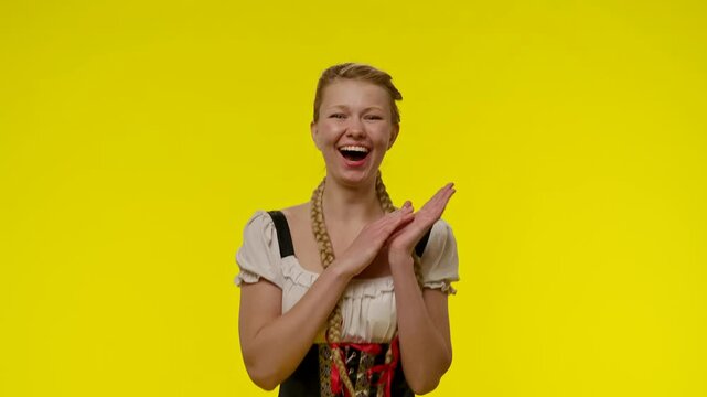 Surprised Woman with Long Braids Poses Against Yellow Background