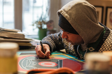 Two Georgian male artists working in their Tbilisi studio. Painting, sketching, interacting with...