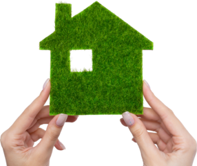Female hands hold a model of a green house close-up. Sale of ecological real estate of the future.