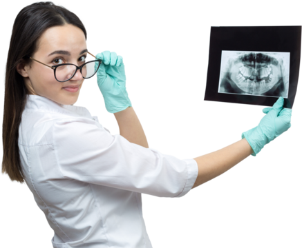 Girl dentist in a white coat holds a snapshot of the patient's teeth.