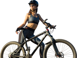 Girl on a mountain bike on offroad, beautiful portrait of a cyclist at sunset, Fitness girl rides a modern carbon fiber mountain bike in sportswear. Close-up portrait of a girl in a helmet and glasses