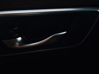 the interior door handle of a car 