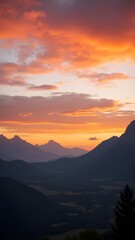 Sunset Over Mountain Landscape with Orange Sky and Silhouettes