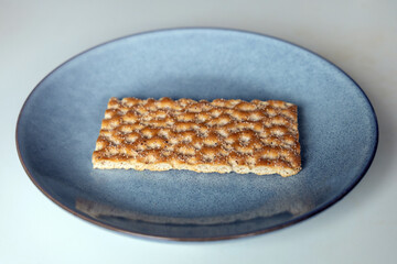 One piece of crunchy crispbread on a plate