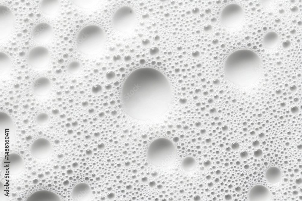Poster water droplets on glass create intricate patterns and textures in a chaotic arrangement