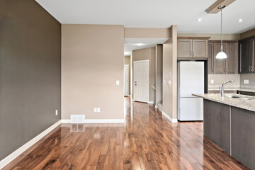 Large open kitchen with a white refrigerator and a sink