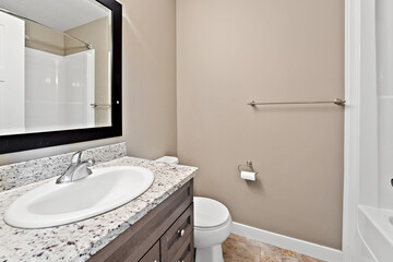 Bathroom with a white sink and toilet