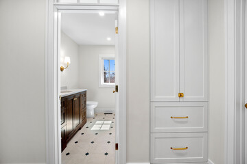 Bathroom with a white cabinet and a toilet