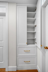 White cabinet with two drawers and a shelf