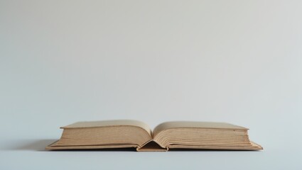 Antique books set on a white surface.