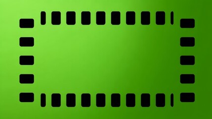 Fototapeta premium Perforated Film Strip Border Against A Vivid Green Background With Soft Vignette Effect