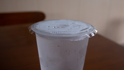 Chilled Mineral Water with Ice in Plastic Cup
