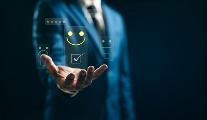 Business people touch virtual screens on the happy Smile face icon to give satisfaction in service. rating very impressed. Customer service and Satisfaction concept.