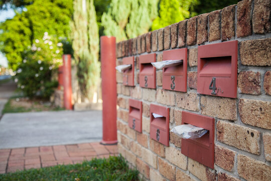 Urban mailboxes in brick wall