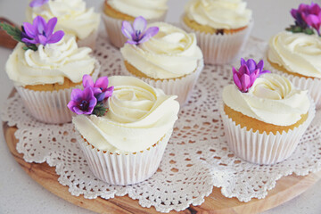 Cupcakes with purple edible flowers for tea party