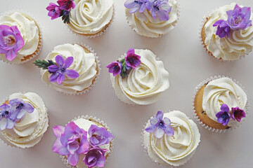 Cupcakes with purple edible flowers for tea party