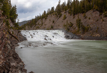 Bow Falls in Banff National Park offers stunning views of cascading waters amidst the majestic Rocky Mountains.