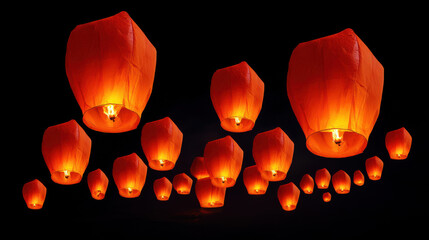 Several vibrant orange sky lanterns float upwards into the dark night sky du a festive celebration, creating a magical and memorable scene for onlookers.