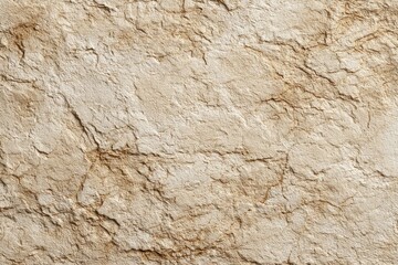 Close-up of textured beige stone wall surface.