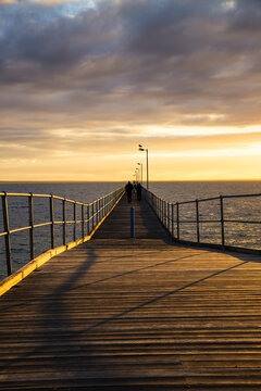 Looking along jetty at sunset