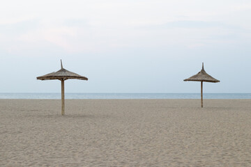Beautiful two Thatched roof constructed along the beach side to rest during sunny days by the tourist, beautifully constructed thatched roof resembles a hut