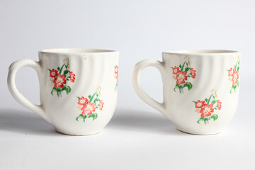 white ceramic cup with floral pattern isolated on home background,vintage interior home furnishings
