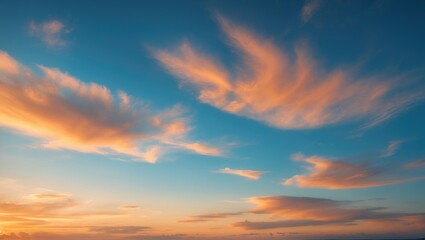 Fototapeta premium Beautiful sky view with luxurious gradient of orange and gold clouds and sunlight, ideal for a peaceful background