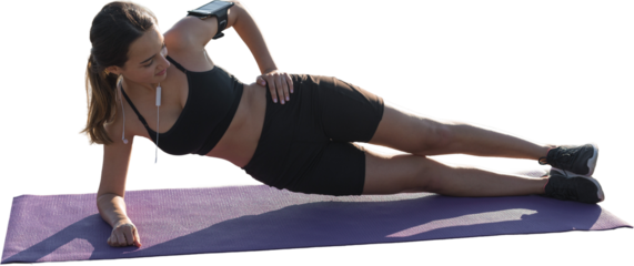 A young slim athletic girl in sportswear with snakeskin prints performs a set of exercises. Fitness and healthy lifestyle.