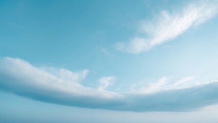 Sunny landscape with a clear blue sky, white clouds, and a natural outdoor environment