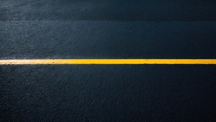 High angle view of a black asphalt highway with a yellow line on top and textured background pattern