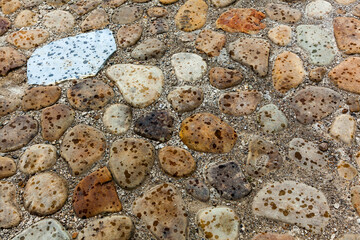  Stone mosaic with varied patterns and the first raindrops