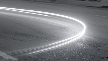 Swift motion capture of car light trails urban street photography nighttime low angle dynamic energy