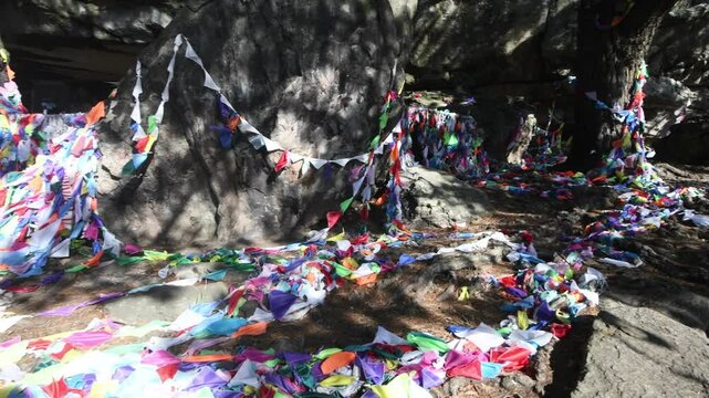 gruta de los pa&ntilde;uelos,sierra de los padres,mar del plata,argentina,grotto,handkerchief,religion,catholic,rock,color,  real time, day,  natural lighting, motion, handkerchiefs hanging in a cave