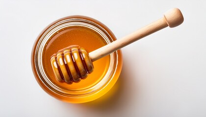 honey on jar with honey dipper white background from above