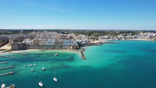 Otranto - Italy, Apulia - Aerial view over the blue-green natural harbor with a view of the old town