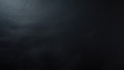 Abstract background featuring a black, rough, textured surface