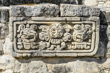 style Aztec stone carving of calendar symbols in ancient relief