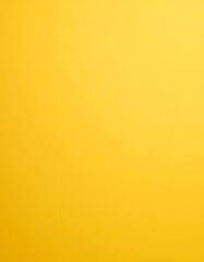 Fototapeta premium A bright yellow background with a smooth texture, evoking feelings of cheerfulness and warmth, perfect for creative or vibrant designs