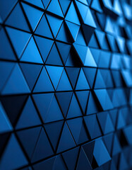 A close-up of a textured surface featuring geometric blue triangles, creating a modern and sleek visual effect