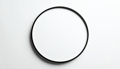 A minimalist circular mirror with a thin black frame against a white background, emphasizing simplicity and modern design