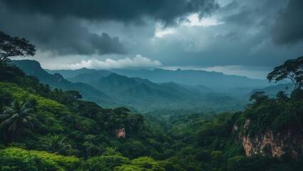 Fototapeta premium Sweeping scene from the viewing platform. Unending valley with hills covered in tropical forests and pointed rock formations. Thunderclouds looming in the stormy sky.