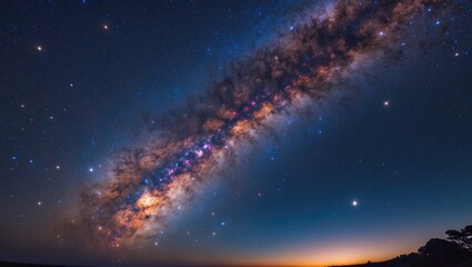 Naklejka premium Before dawn, the Milky Way and a brilliant golden light can be observed in a stunning galaxy.