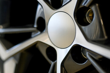 Car wheel with brake calipers and stylish design.Close up