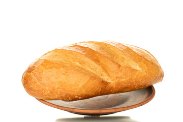 One wheat bun, close-up, isolated on a white background.
