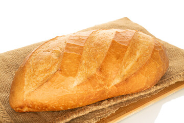 One wheat bun, close-up, isolated on a white background.