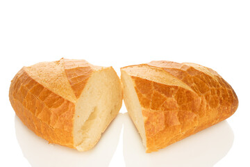 One wheat bun, close-up, isolated on a white background.