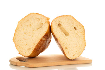 One wheat bun, close-up, isolated on a white background.
