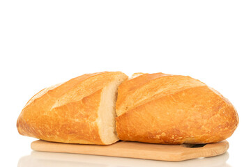 One wheat bun, close-up, isolated on a white background.